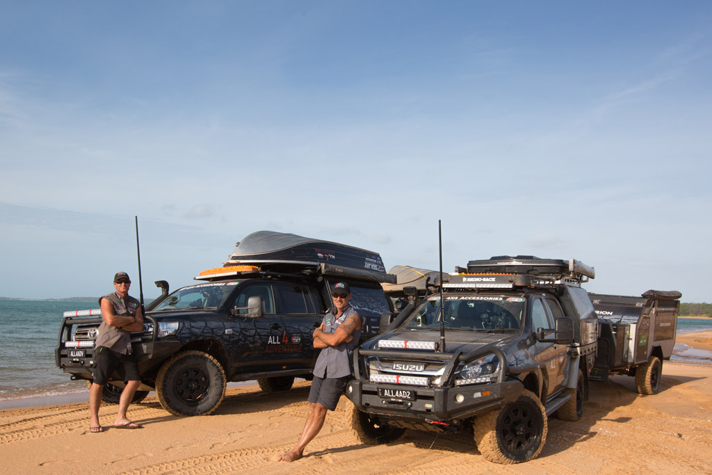 Jase and Simon from All 4 Adventure on beach in front of their vehicles